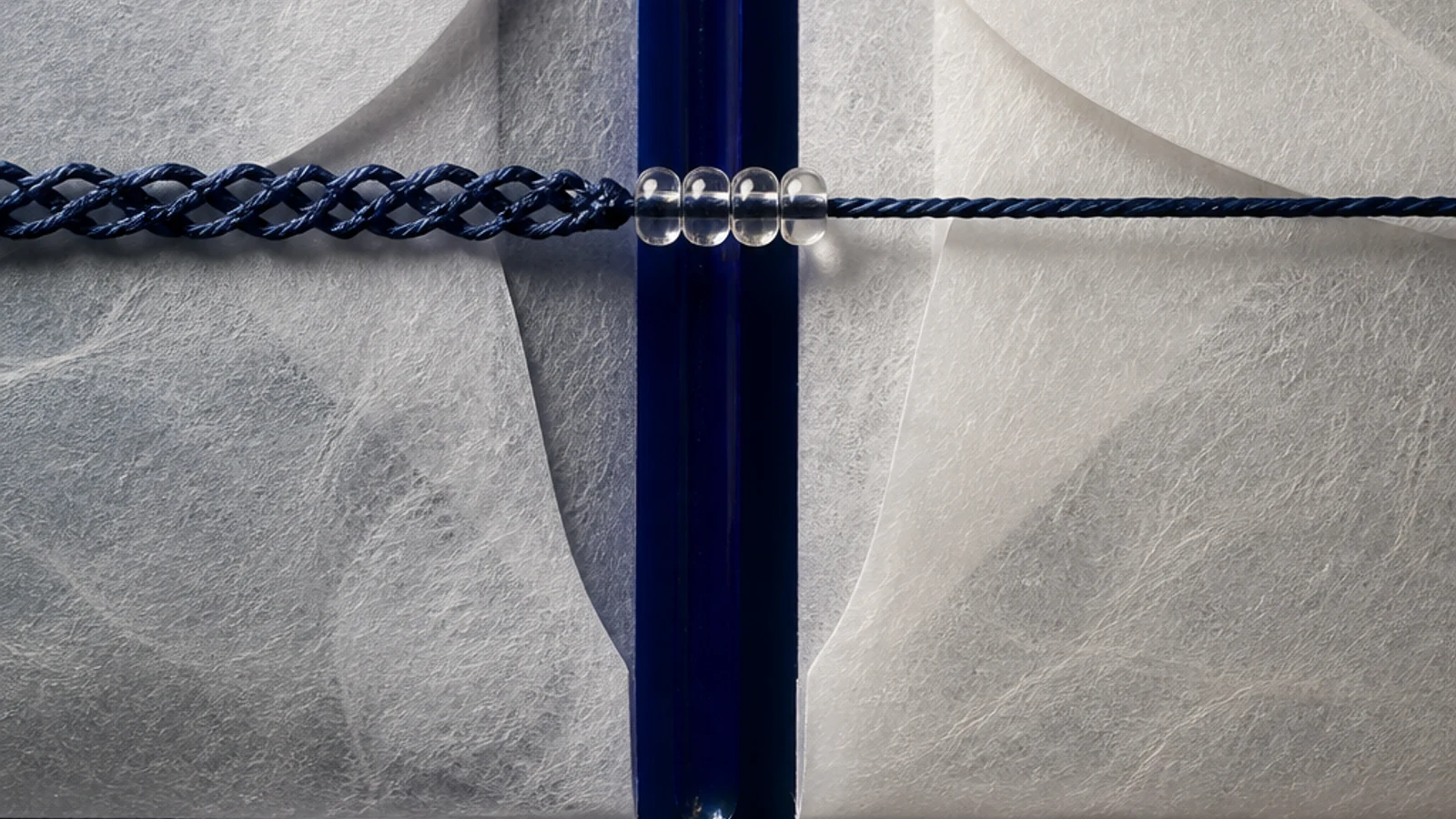 A folded indigo data map crosses a pale border while a small operator checks each handoff.